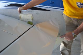 Checking the rigging on a flap